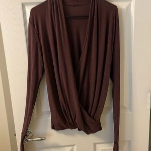 Lululemon top with cross over and long sleeves with slit for your thumbs